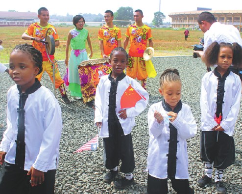 Young students of the Chinese Wushu School in Monrovia prepare for a show piece. (Photo provided to China Daily)
