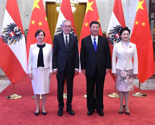 President Xi Jinping and his wife, Peng Liyuan, pose for a photo with Austrian President Alexander Van der Bellen and his wife, Doris Schmidauer, during a welcoming ceremony at the Great Hall of the People in Beijing on Sunday. (Photo/China Daily)