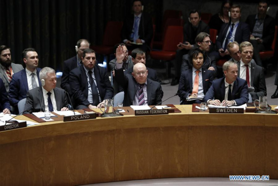 Russian Ambassador to the United Nations Vassily Nebenzia (C, Front) vetos a U.S.-drafted resolution on probe of chemical weapons use in Syria at the UN headquarters in New York, April 10, 2018. Russia vetoed a U.S.-drafted Security Council resolution on probe of chemical weapons use in Syria on Tuesday. (Xinhua/Li Muzi)