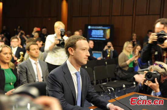 Facebook CEO Mark Zuckerberg listens while testifying before a joint Senate Judiciary and Commerce Committees hearing regarding the company's use and protection of user data, on Capitol Hill in Washington, U.S., April 10, 2018. During nearly five hours of questioning by 44 U.S. senators, Zuckerberg repeated apologies he previously made for a range of problems that have beset Facebook. (Photo: China News Service/Deng Min)
