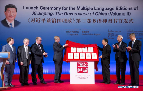 Britain's Prince Andrew (4th L), the Duke of York, unveils the multilingual versions of the second volume of Xi Jinping: The Governance of China with Jiang Jianguo (3rd R), minister of China's State Council Information Office, at the launch ceremony in London, Britain on April 11, 2018. The book was launched in London Wednesday. (Xinhua/Isabel Infantes)