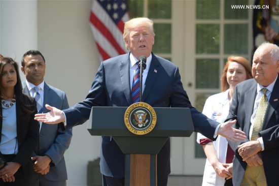U.S. President Donald Trump (C) delivers a speech at the White House, the United States, on April 12, 2018. U.S. President Donald Trump said on Thursday that he was going to hold meeting on Syria and the decisions on the U.S. response to the suspected chemical weapons attack in Syria will be made fairly soon. (Xinhua/Yang Chenglin)