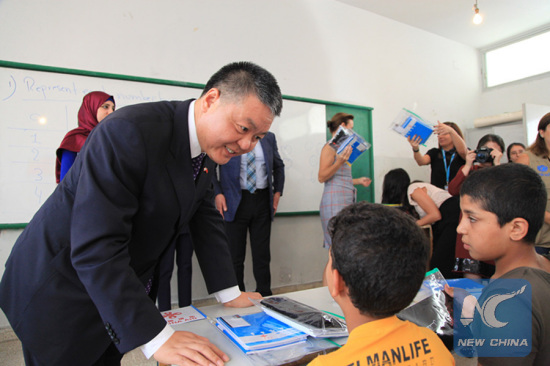 In this file photo, Chinese Ambassador to Lebanon Wang Kejian delivered school supplies to Syrian refugee students in a school in Beirut, Lebanon on Oct. 23, 2017. China donated 1 million U.S. dollars to the UNICEF for providing school aid to Syrian refugee students in Lebanon. (Xinhua/Li Liangyong)