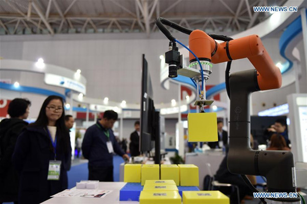 Photo taken on April 13, 2018 shows an exhibit of a robot firm during the 2018 China (Tianjin) International Fair for Investment and Trade & Pacific Economic Cooperation Council (PECC) Exposition in Tianjin, north China, 2018. The expo kicked off Friday here in Tianjin. (Xinhua/Li Ran)