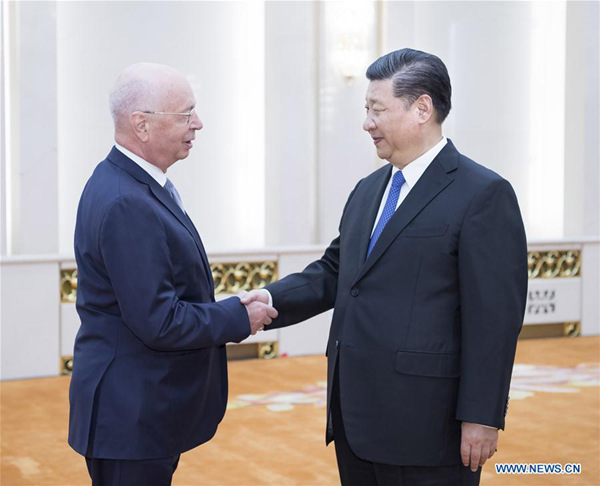 Chinese President Xi Jinping (R) meets with Klaus Schwab, founder and executive chairman of the World Economic Forum (WEF), in Beijing, capital of China, April 16, 2018. (Xinhua/Li Tao)