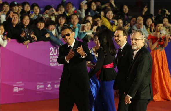 Some jury members of the Beijing International Film Festival make their debut on the red carpet on Sunday. (Photo by Jiang Dong/China Daily)