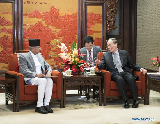 Chinese Vice President Wang Qishan (R) meets with Foreign Minister of Nepal Pradeep Kumar Gyawali in Beijing, capital of China, April 18, 2018. (Xinhua/Wang Ye)