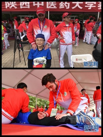 International faces seen performing massage in Beijing Half Marathon's after-running recovery therapy, April 16, 2018. /Xinhua Photo