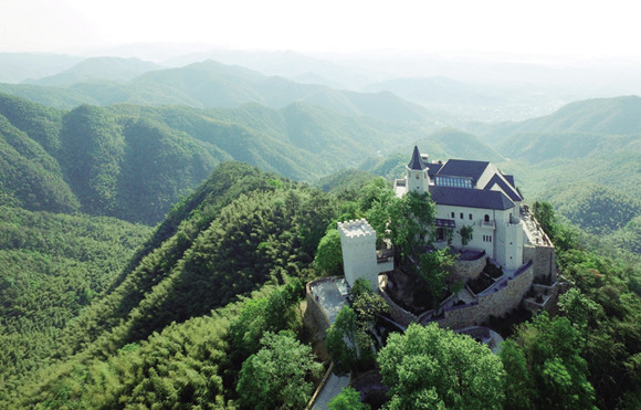 Naked Castle, a resort developed by the Naked Group, sits atop a hill in the Mogan Mountain area of Deqing, Zhejiang province. Photo/China Daily