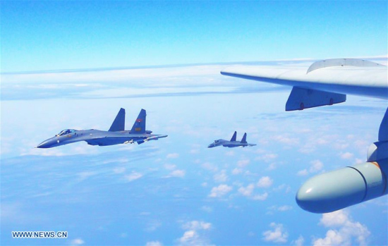 Chinese air force formation including H-6K bomber conduct island patrol in April 19, 2018. (Xinhua/Zhai Peisong)