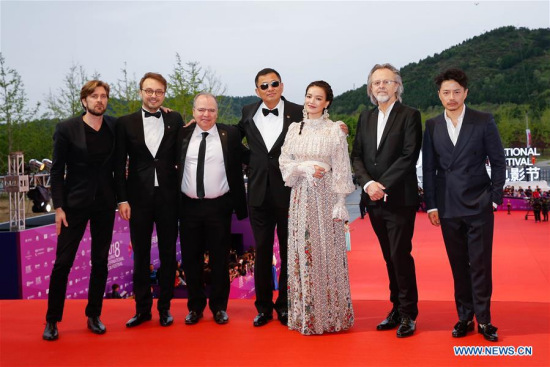 Jury members pose on the red carpet for the closing ceremony of the 8th Beijing International Film Festival (BJIFF) in Beijing, capital of China, April 22, 2018. (Xinhua/Zhang Yuwei)