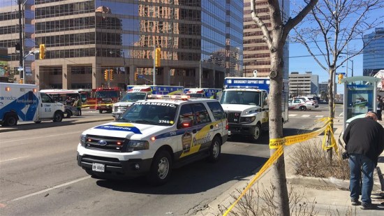 Ambulances are seen near the site where a van struck pedestrians in Toronto, Canada, April 23, 2018. A white van struck multiple pedestrians in Toronto's northern suburbs on Monday and police have taken the driver into custody, police said on Twitter. (Xinhua/Zou Zheng)