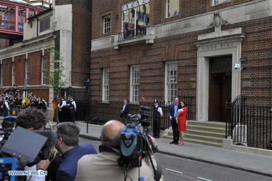 Prince William (2nd R, Rear), Duke of Cambridge, and his wife Catherine (1st R, Rear), Duchess of Cambridge, present their newborn son outside St. Mary's Hospital in London, Britain, on April 23, 2018. Catherine on Monday gave birth to a boy, her third child, who is the fifth in line to the British throne. (Xinhua/Stephen Chung) 