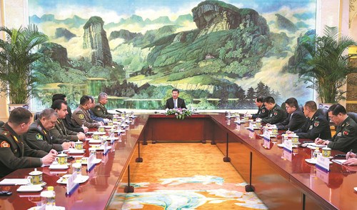 President Xi Jinping, who is also chairman of the Central Military Commission, meets with all Shanghai Cooperation Organization defense ministers in Beijing at the Great Hall of the People on Monday. FENG YONGBIN / CHINA DAILY