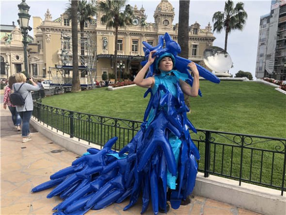 Chinese artist Kong Ning wears her Little Blue Man suit. (Photo by Sai Hu/provided to chinadaily.com.cn)