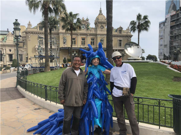 Chinese artist Kong Ning wears her Little Blue Man suit. (Photo by Sai Hu/provided to chinadaily.com.cn)