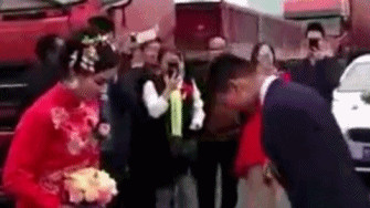 Chinese couple caught in traffic wed on highway