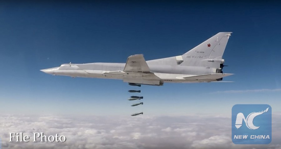 In this photo made from the footage taken from Russian Defense Ministry official web site on Sunday, Nov. 26, 2017 shows a Russian Tu-22M3 long-range bomber strikes the Islamic State targets in Syria. (Photo by Russian Defense Ministry)