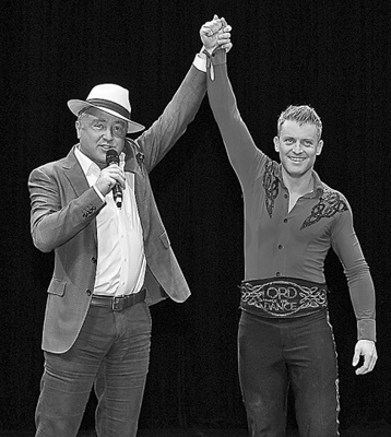 Michael Flatley (left) and James Keegan, lead dancer in Lord of the Dance: Dangerous Games.(Photo for China Daily /Chai Chunxia)