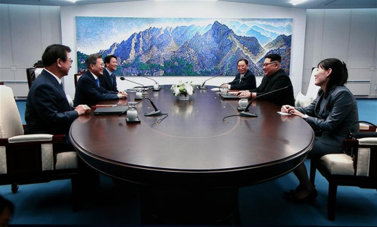 Photo taken on April 27, 2018 from TV screen shows South Korean President Moon Jae-in (2nd L) meeting with top leader of the Democratic People's Republic of Korea (DPRK) Kim Jong Un (2nd R) at the Peace House, a building in the South Korean side of Panmunjom. Moon Jae-in arrived Friday morning in the border village of Panmunjom for his first summit with Kim Jong Un. (Xinhua/Li Peng)