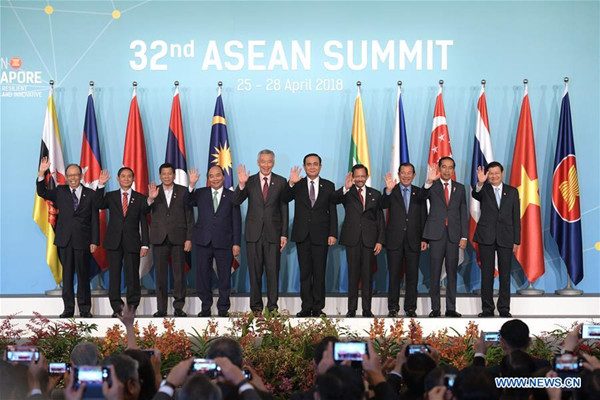 ASEAN leaders pose for a group photo during the opening ceremony of the 32nd ASEAN Summit held in Singapore on April 28, 2018. The 32nd summit of the Association of Southeast Asian Nations (ASEAN) concluded in Singapore Saturday, reaffirming the bloc's cooperation and common vision. (Xinhua/Then Chih Wey)