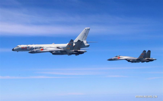 A Chinese People's Liberation Army (PLA) air force formation conducts island patrols during training on April 26, 2018. (Xinhua/Wu Yuepeng)