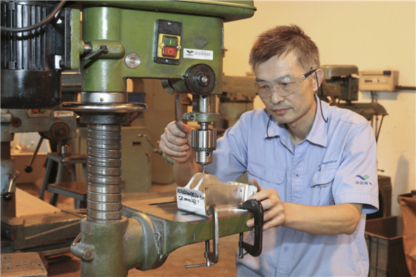 Hu Shuangqian at work.（Photo provided to China Daily）