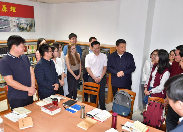 Chinese President Xi Jinping, also general secretary of the Communist Party of China Central Committee and chairman of the Central Military Commission, joins a group of Chinese and foreign students who are discussing topics related to interpreting the new era at the School of Marxism of Peking University (PKU) in Beijing, capital of China, May 2, 2018. Xi made an inspection tour of PKU on Wednesday. (Xinhua/Li Tao)