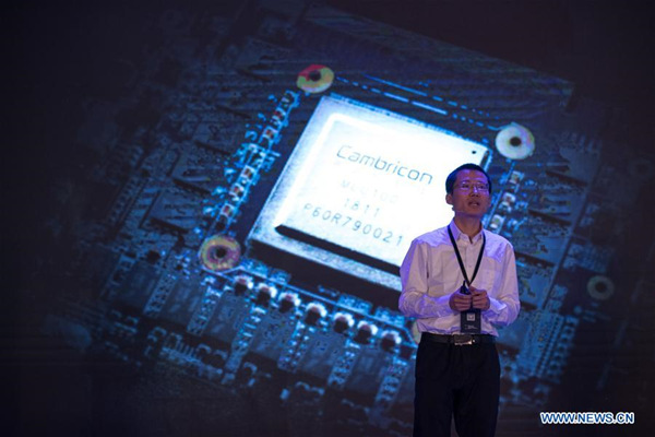Cambricon Technology CEO Chen Tianshi introduces the cloud AI chip MLU100 in Shanghai, east China, May 3, 2018. China's first cloud artificial intelligence (AI) chip was released by the Chinese Academy of Sciences (CAS) on Thursday in Shanghai. The cloud chip MLU100, developed by Cambricon Technology, will have accurate and fast big data processing ability, especially in image and voice search methods. (Xinhua/Jin Liwang)