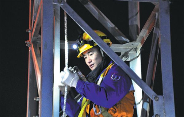 Maintenance team scales heights to keep trains moving