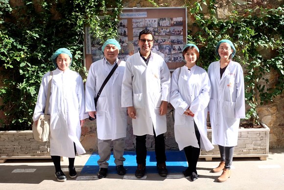 Fang Xidong (far right) visits a candy factory in Casablanca, Morocco, with Chinese importers.[Photo provided to China Daily] Chinese universities are offering students the chance to gain work experience with international organizations as the nation aims to better express its ideas on the world stage.  Fang Xidong's three-month internship at the United Nations International Trade Center in Geneva widened her view of the world.  Assigned to the independent evaluation unit of the center, Fang's job largely involved evaluating projects conducted by the organization and summarizing their achievements.  Like most interns, reading a wide variety of reports was part of the job, said the 24-year-old graduate student in international business at Shanghai University of Finance and Economics.  The job presented a more colorful world to me. I used to only follow the news coming out of countries such as the United States, the United Kingdom and Australia.  Through the internship, Fang, who also holds a degree in finance from Queen Mary University of London in the UK, learned about the export of Colombian cocoa beans, the manufacturing of Moroccan canned seafood and the types of economic assistance provided for women in developing countries.  Everyone at the ITC is devoted to making the world a better place, and I'm grateful for the opportunity to have worked there and learn more about the world, she said.  Fang is among the 100 students on a SUFE program, launched in 2015, that provides participants with the chance to study at one of five overseas universities affiliated with SUFE, such as the University of North Carolina at Charlotte and George Washington University, as well as undertaking internships at international organizations or institutions related to foreign affairs.  Most of the expenses related to the program, such as tuition fees, scholarships and meals, accommodations and medical insurance, are covered by the China Scholarship Council.  The program aims to educate financial, commercial and legal professionals who can express Chinese ideas on the global stage, said Li Jinsong, deputy dean of the Postgraduate School at Shanghai University of Finance and Economics.  We will expand our cooperation with more universities and organizations to provide students with more internship opportunities in the future.  Fang said that while working in such a multicultural environment can be a challenge, her knowledge of international economics, politics, law and research methodology, which she picked up during her senior year at SUFE, helped her to find her feet with relative ease.  In terms of my career, I will first find a job in a large multinational company, laying the foundation for my dream to work in international organizations where professional working experience is a must for candidates, said Fang, who is now preparing her graduation thesis in Shanghai.  Like Fang, 23-year-old graduate student Zou Nan has recently completed an internship, but at the International Finance Corporation, a member of the World Bank Group in the United States.  In her role, Zou was responsible for the collection of data about relevant indicators and the assessment of projects for more than 100 developing member countries of the World Bank Group.  I was very nervous at first because I knew little about developing countries and the meaning of most of the indicators used in the reports, she said.  But I managed to learn on the job quickly, and the knowledge gained from the program proved to be very useful.  Liang Guoyong, an official at the United Nations Conference on Trade and Development, said adaptability is a key trait for students when working in international groups.  International organizations have a multilingual and cross-cultural working environment. Requirements vary in different organizations and positions. What interns need is excellent professional skills and the ability to adapt, Liang said.  Tough selection process  Candidates aiming to be a part of the three-year program have to meet the high standards set by SUFE.  Rong Jun, deputy director of the International Exchanges and Cooperation Department at the university, said candidates are required to take written tests in Chinese and English, seven rounds of interviews on various topics not limited to finance, law and international relations, and to deliver prepared and impromptu speeches. Their grades are also taken into consideration.  The students selected for the program also have to take extra classes to gain knowledge about international groups and learn a third language in addition to Chinese and English.  It's truly a tough challenge for them to acquire a third language such as French, Arabic or Spanish within a year, said Cheng Qian, a professor at the university's Foreign Language Institute.  But it is important, as they may need to communicate with other people in that language during their internships.  The first year of graduate study begins at universities overseas, during which students are provided with internship opportunities in international organizations or institutions such as the United Nations, the World Bank and the Inter-American Development Bank.  The second year involves writing a dissertation back in China. Students may also apply for internships at the Chinese branches of international organizations and institutions, such as the New Development Bank and the Asian Infrastructure Investment Bank.  Students who successfully graduate from both domestic and foreign universities are awarded a double Master's degree.  The program has been well-received by universities and organizations. The students have always put forward good ideas, said Chan Soon Huat, director of the Master of Science in Applied Finance Programme at Singapore Management University. I have been surprised at how professional Chinese students are during their time here.  Xu Jianjun, an official at the international promotion and cooperation department of the Inter-American Development Bank, said Chinese interns are well-equipped with strong business, learning and communication skills, and adapt easily to the international environment.  As our first cooperative project with universities in China, the program plays a vital role in demonstrating how Chinese talent can be cultivated for international organizations, Xu said.  A national initiative  Since the project to nurture talent suited to international organizations was launched, a steady stream of Chinese have worked for international bodies such as the Office of the United Nations High Commissioner for Refugees and the International Telecommunication Union.  According to the Ministry of Education, Chinese students started interning at the United Nations Educational Scientific and Cultural Organization in 2015. Among that first group of interns, four were employed by UNESCO and the International Court of Justice.  Like SUFE, Beijing Foreign Studies University has been grooming talent with excellent foreign language and intercultural communication skills since 2015.  The university has established the Institute of International Organizations, the Silk Road Research Institute and the International Organizations Research Center to help students better understand other countries.  Meanwhile, Renmin University of China has set up an information network that offers basic knowledge of international groups. It also regularly organizes a series of seminars to encourage further learning in the field.  The Graduate Institute of Translation and Interpretation at Shanghai International Studies University has been a key player in training translators and interpreters for international organizations. Students at the university can major in one of the six official languages used by the UN.  Other institutes of higher learning, such as Tsinghua and Fudan universities, are teaching students management skills in a global environment. As of the end of 2014, only 1.09 percent of staff members at the UN Secretariat were Chinese, according to official data, while 6.03 percent came from the United States.  This national strategy to cultivate talent for international organizations should be given priority by more universities, said Pu Ping, professor at the Institute of International Relations at Renmin University of China, speaking last year at a forum on the cultivation of talent for international organizations. Good curriculum design for third languages, international relations and law is essential to achieving this goal. More opportunities, be it internships at international groups or volunteering at global conferences, should also be provided.
