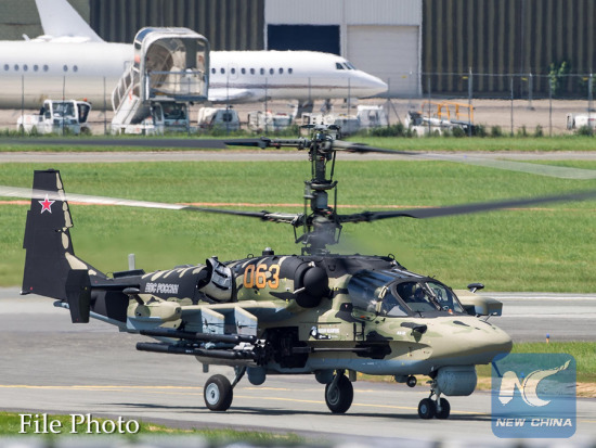 A Russian Ka-52 military helicopter participates in a flying display during the 50th International Paris Air Show at the Le Bourget airport in Paris, France, June 18, 2013. (Xinhua/Chen Cheng)