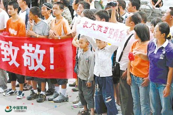 Cheng holds a banner 
