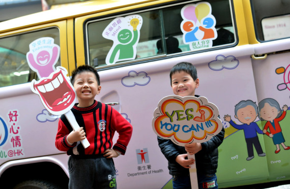 Students hold placards during the campaign, which was held at the Pak Shek Kok Promenade at the Hong Kong Science Park. (Photo/China Daily)