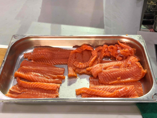 Atlantic salmon awaiting seasoning and cooking. /CGTN Photo