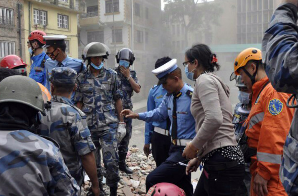 Members of the Clouded Leopard Rescue Team at work during the relief efforts after the Nepal earthquake in April 2015.  (Photo for China Daily/Tang Huaming)