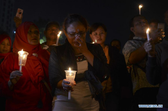 People gather during solidarity for victims after three churches bombing in Bandung, West Java, Indonesia, May 13, 2018. (Xinhua/Septianjar)