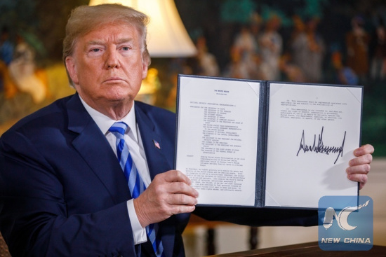 U.S. President Donald Trump displays a signed presidential memorandum at the White House in Washington D.C., the United States, on May 8, 2018. U.S. President Donald Trump said that the United States will withdraw from the Iran nuclear deal, a landmark agreement signed in 2015. (Xinhua/Ting Shen)