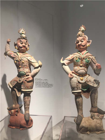 The ongoing exhibition at Shanghai Tower features fullsize replicas of grottoes in Dunhuang and precious cultural relics from seven museums in western China. (Photos by Gao Erqiang and Lin Shujuan / China Daily)