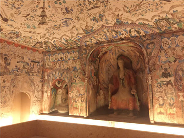 The ongoing exhibition at Shanghai Tower features fullsize replicas of grottoes in Dunhuang and precious cultural relics from seven museums in western China. (Photos by Gao Erqiang and Lin Shujuan / China Daily)