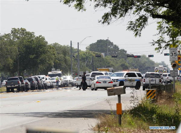 Police cars are seen around Santa Fe High School in Texas, the United States, on May 18, 2018. Eight to ten people have been killed after a shooter opened fire inside Santa Fe High School Friday morning in the southeast of Houston, in the U.S. state of Texas, local police said. (Xinhua/Steven Song)