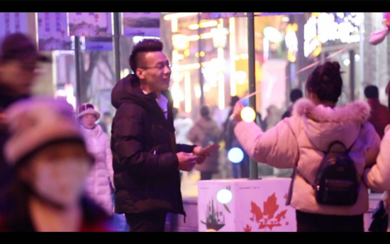 A student in Jinan putting his dating tips to use trying to get a girl to add him to her WeChat contacts. /CGTN Digital