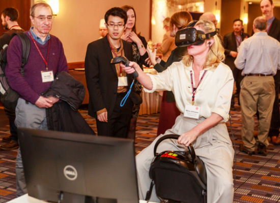 Visitors try out virtual reality products of NetDragon at a symposium at Harvard University in January last year. (Photo provided to China Daily)