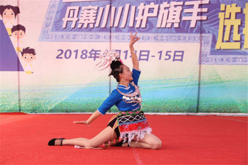 Zhou Lulu a competitor from Danzhai shows ethnic dancing. (Photo provided to China Daily)