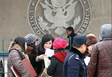 Visa applicants gather outside the US embassy in Beijing on Jan 30. [Photo / China Daily] 