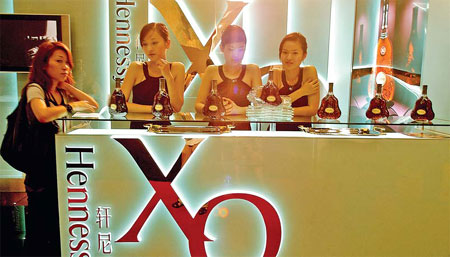 Moet Hennessy products at a luxury brands event in Shanghai. The company will establish a joint venture with China's VATS Group to produce premium red wine in Yunnan province. [Photo/China Daily]