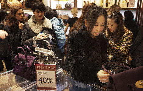 Shoppers at Harrods department store in London. According to China UnionPay Co Ltd, overseas consumption made through its credit card network jumped by 66.7 percent to 300 billion yuan ($47 billion) last year, up from 180 billion yuan in 2010. [Photo / Reuters]