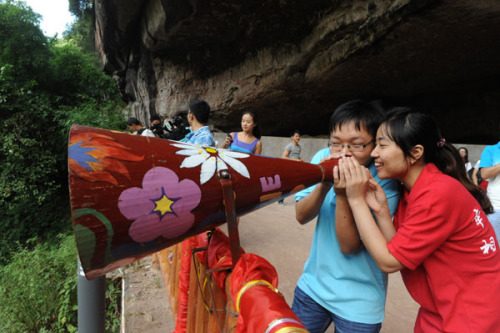 We are going to get married next year! a couple shouts through a loudspeaker at a celebration activity on Sunday for the upcoming Qixi Festival in Chongqing. Qixi Festival, a traditional day of romance in China, falls on the seventh day of the seventh lunar month, and this year it falls on Thursday. Shi Zongwei / China Daily