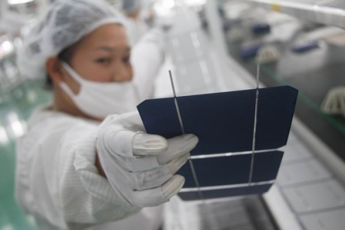 A solar panel production line at an enterprise in Nantong, Jiangsu province. China's solar product exports to the EU were valued at $20.4 billion in 2011. [Photo/China Daily]