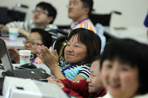 People with osteogenesis imperfecta, also known as brittle bone disease, receive customer service training from Alibaba Group's Taobao.com, an e-commerce website. Wu Jiang / for China Daily